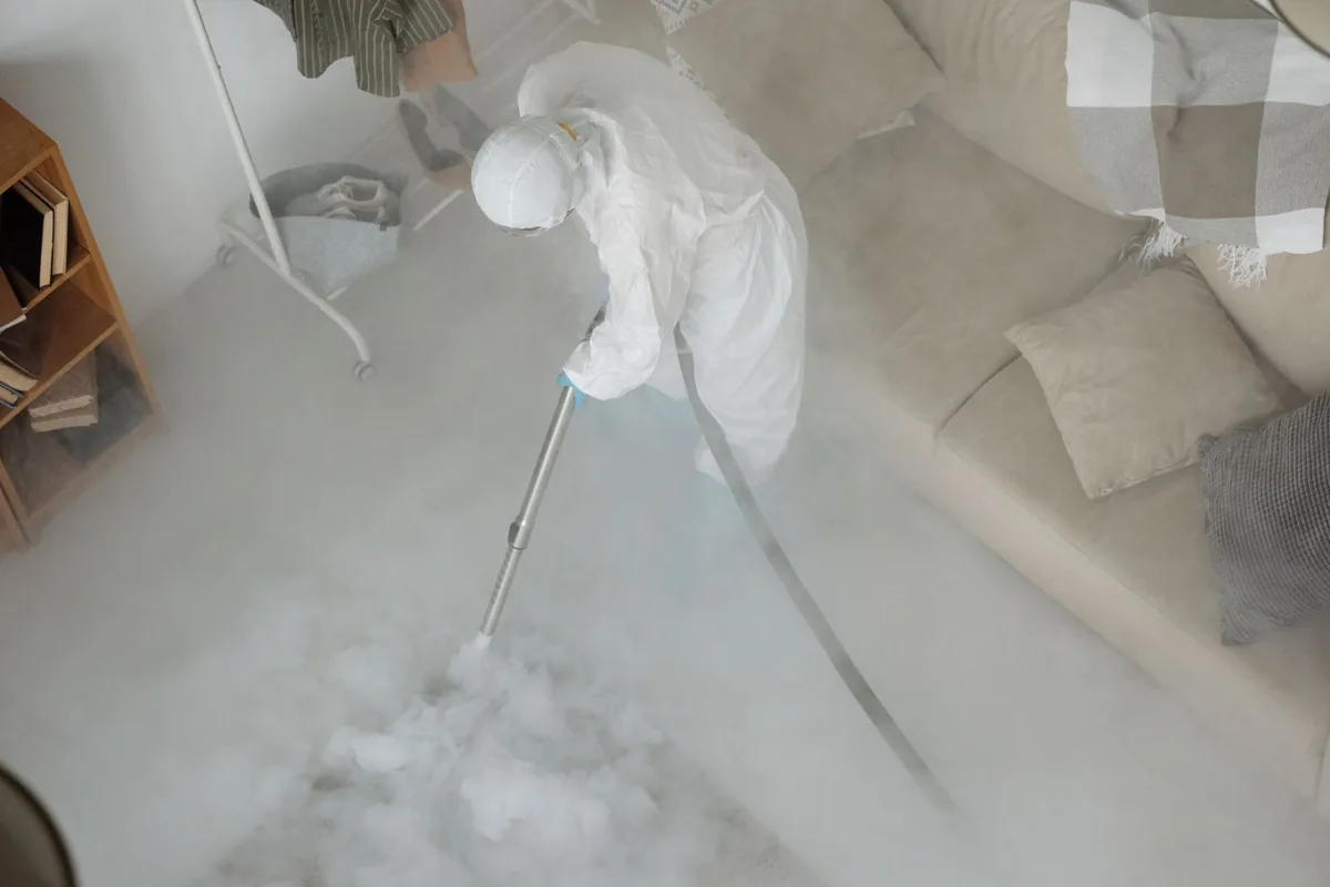 Biohazard cleanup technician in protective equipment, Osprey, FL